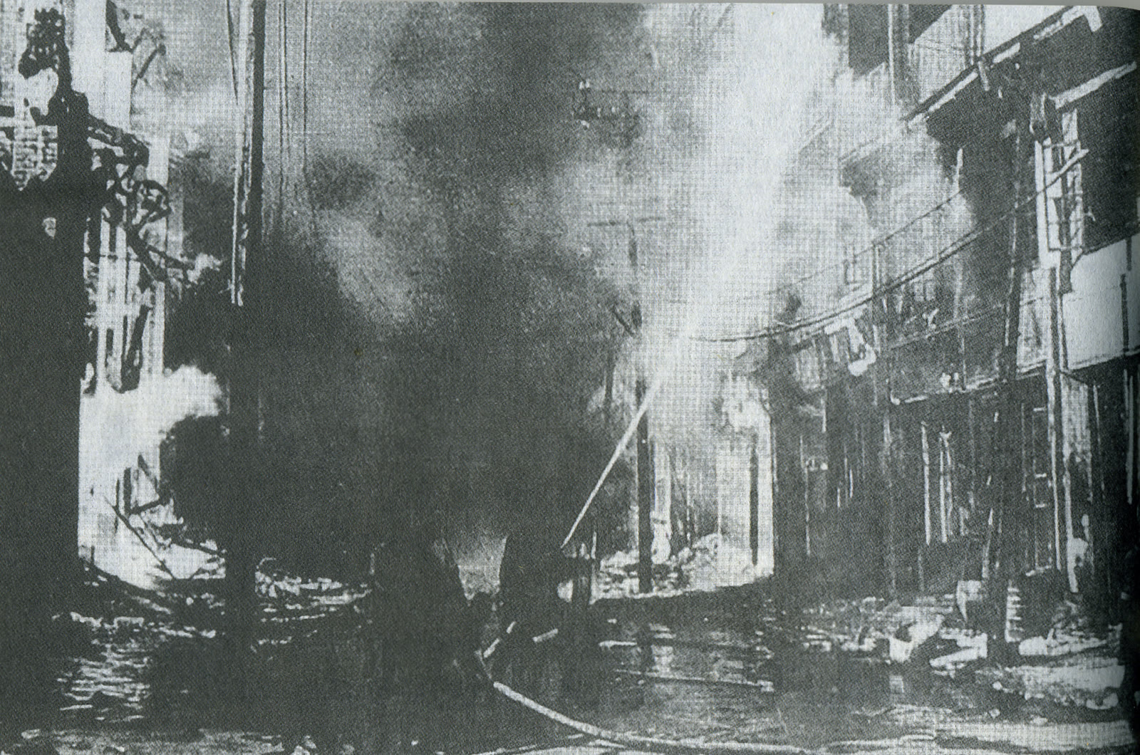 A Chongqing street after a raid in 1941, buildings gutted.