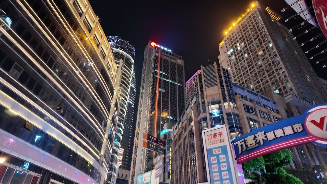 The towers of Raffles City Chongqing seen from below, the horizontal Crystal bridging them.